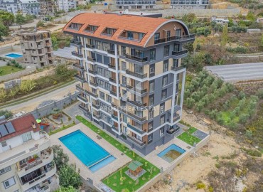 Элегантные двухкомнатные апартаменты, 50м², в новом комфортабельном комплексе в Авсалларе, Алания ID-18666 фото-16