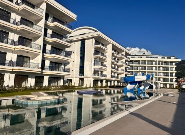 Дизайнерская квартира 1+1, 55м², в новостройке премиум класса в районе Алании – Оба по привлекательной цене ID-18667 фото-1