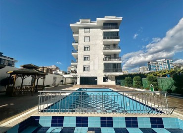 Двухкомнатная меблированная квартира, 50м², в новом комфортабельном комплексе, у моря в Каргыджаке, Алания ID-18677 фото-18