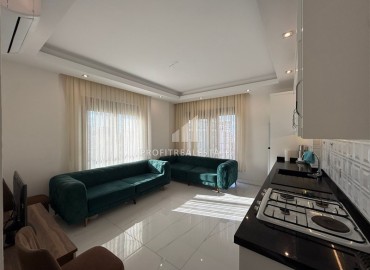 Уютная квартира с одной спальней, 57м², в новом комплексе премиум класса в 700 метрах от моря в Махмутларе, Алания ID-18687 фото-2