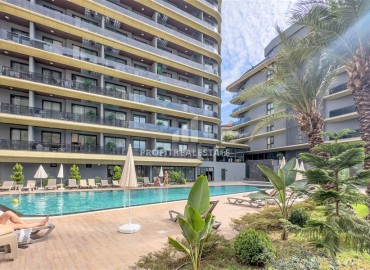 Элитная недвижимость в центре Алании: элегантные двухкомнатные апартаменты, 60м², в резиденции премиум класса в 350м от моря ID-18688 фото-1