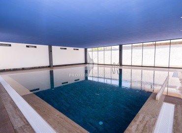 Апартаменты с одной спальней, 55м², в новостройке с отличной локацией в 300м от моря в районе Каргыджак, Алания ID-18689 фото-14