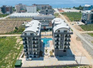 Апартаменты с одной спальней, 55м², в новостройке с отличной локацией в 300м от моря в районе Каргыджак, Алания ID-18689 фото-20