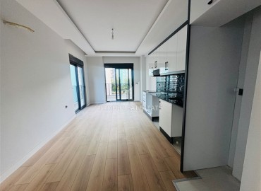 Двухкомнатная квартира, 55м², в резиденции с хорошей инфраструктурой в 500м от моря в Махмутларе, Алания ID-18703 фото-3