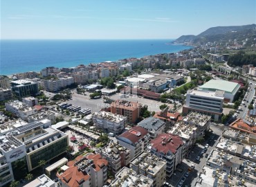 Элегантная двухкомнатная квартира, 55м², в современной резиденции у пляжа Клеопатры в центре Алании под ВНЖ ID-18730 фото-1