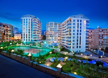 Стильная квартира с одной спальней, 65м², с потрясающим видом на море в элитном комплексе в районе Алании - Тосмур ID-18735 фото-1