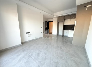 Двухкомнатные апартаменты, 60м², с чистовой отделкой в элитном новом комплексе в районе Махмутлар, Алания ID-18748 фото-2