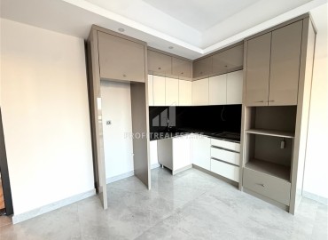 Двухкомнатные апартаменты, 60м², с чистовой отделкой в элитном новом комплексе в районе Махмутлар, Алания ID-18748 фото-3