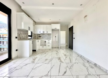 Комфортабельная недвижимость в центре Алании у пляжа Клеопатры: квартира с одной спальней, 68м², в новом комплексе ID-18757 фото-2