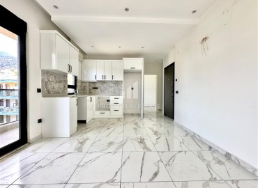 Комфортабельная недвижимость в центре Алании у пляжа Клеопатры: квартира с одной спальней, 68м², в новом комплексе ID-18757 фото-4