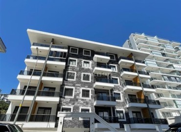 Квартира с одной спальней, 55м², в комплексе с зимним бассейном в 650м от моря в районе Махмутлар, Алания ID-18760 фото-1
