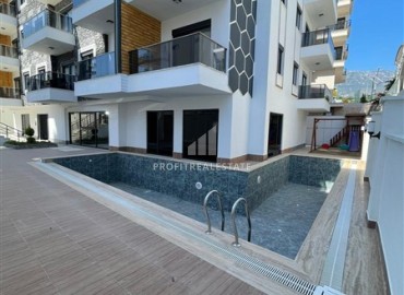 Квартира с одной спальней, 55м², в комплексе с зимним бассейном в 650м от моря в районе Махмутлар, Алания ID-18760 фото-10