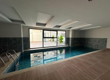 Квартира с одной спальней, 55м², в комплексе с зимним бассейном в 650м от моря в районе Махмутлар, Алания ID-18760 фото-17