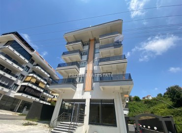 Новая двухкомнатная квартира, 50м², с чистовой отделкой в комплексе с бассейном в Авсалларе, Алания ID-18764 фото-1