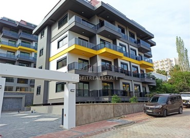 Меблированные двухкомнатные апартаменты, 50м², в комфортабельной новостройке в 500м от моря в районе Кестель, Алания ID-18773 фото-1