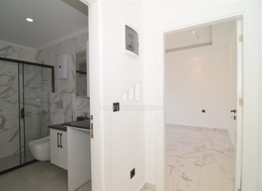 Двухкомнатная квартира, 50м², в новом комплексе с зимним бассейном, с отличной локацией в центре Алании ID-18783 фото-10