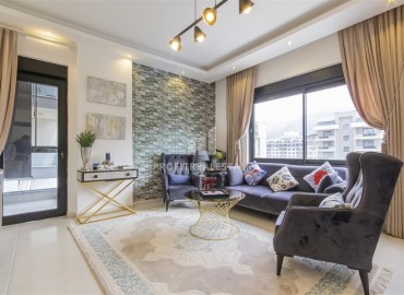 Новые двухкомнатные апартаменты, 55м², с дизайнерским интерьером, в 150м от моря в районе Каргыджак, Алания ID-18801 фото-2