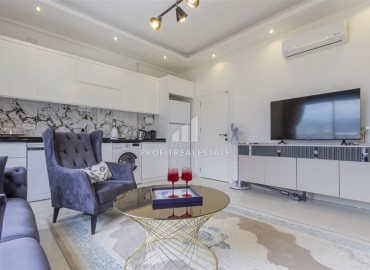 Новые двухкомнатные апартаменты, 55м², с дизайнерским интерьером, в 150м от моря в районе Каргыджак, Алания ID-18801 фото-3