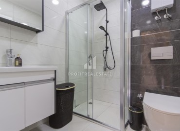 Новые двухкомнатные апартаменты, 55м², с дизайнерским интерьером, в 150м от моря в районе Каргыджак, Алания ID-18801 фото-7