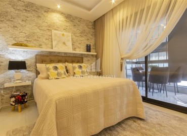 Новые двухкомнатные апартаменты, 55м², с дизайнерским интерьером, в 150м от моря в районе Каргыджак, Алания ID-18801 фото-8