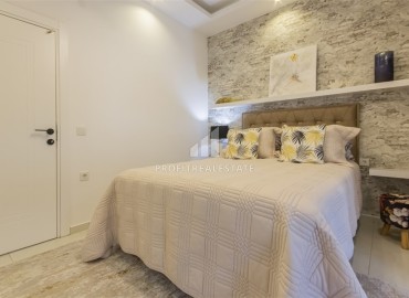 Новые двухкомнатные апартаменты, 55м², с дизайнерским интерьером, в 150м от моря в районе Каргыджак, Алания ID-18801 фото-9