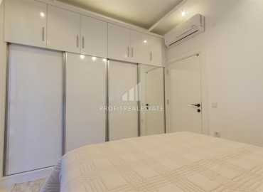 Новые двухкомнатные апартаменты, 55м², с дизайнерским интерьером, в 150м от моря в районе Каргыджак, Алания ID-18801 фото-10