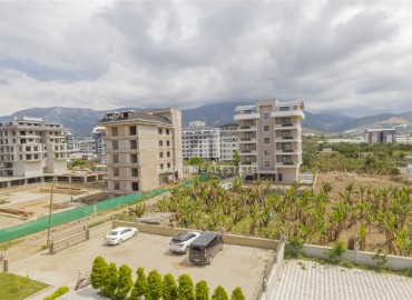 Новые двухкомнатные апартаменты, 55м², с дизайнерским интерьером, в 150м от моря в районе Каргыджак, Алания ID-18801 фото-12