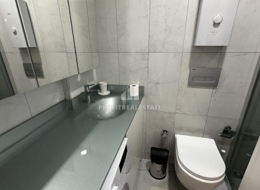 Готовые к проживанию, двухкомнатные апартаменты, 48м², в комплексе с инфраструктурой в районе Алании Тосмур ID-18810 фото-8