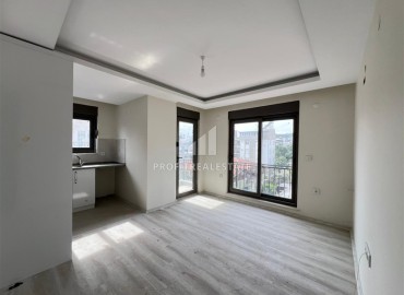 Новая двухкомнатная квартира, 45м², в доме с парковкой в Анталии, район Кепез, Варсак по выгодной цене ID-18818 фото-3