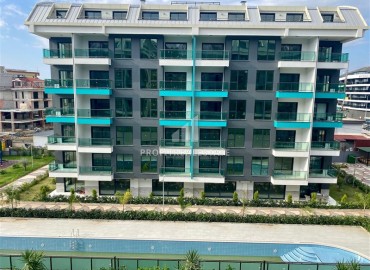 Новая трехкомнатная квартира, 105м², в элитном комплексе в престижном районе Алании – Каргыджак, в 200м от моря ID-18824 фото-1