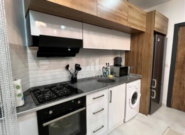 Уютная двухкомнатная квартира, 60м², со стильным интерьером в современном комплексе с отличной локацией в Махмутларе, Алания ID-18825 фото-3