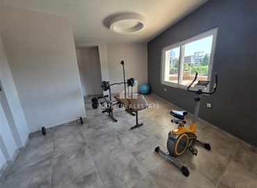 Уютная двухкомнатная квартира, 60м², со стильным интерьером в современном комплексе с отличной локацией в Махмутларе, Алания ID-18825 фото-7