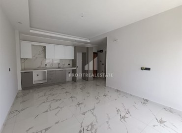 Квартира с одной спальней, 63м², в строящемся комплексе, в 550м от моря в районе Тосмур, Алания ID-14187 фото-3