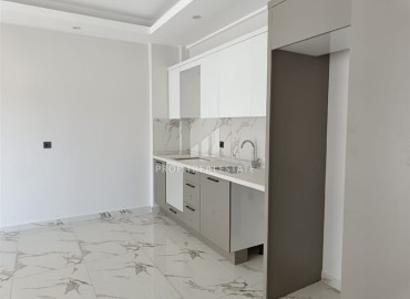 Квартира с одной спальней, 63м², в строящемся комплексе, в 550м от моря в районе Тосмур, Алания ID-14187 фото-4