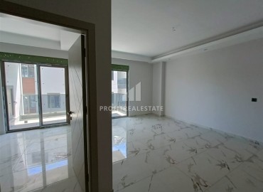 Квартира с одной спальней, 63м², в строящемся комплексе, в 550м от моря в районе Тосмур, Алания ID-14187 фото-5