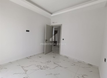 Квартира с одной спальней, 63м², в строящемся комплексе, в 550м от моря в районе Тосмур, Алания ID-14187 фото-7