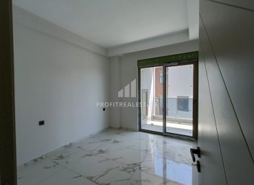 Квартира с одной спальней, 63м², в строящемся комплексе, в 550м от моря в районе Тосмур, Алания ID-14187 фото-9