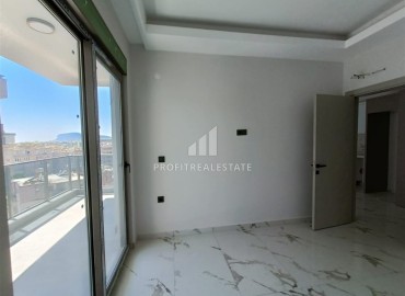 Квартира с одной спальней, 63м², в строящемся комплексе, в 550м от моря в районе Тосмур, Алания ID-14187 фото-10