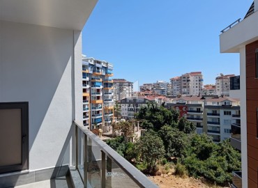 Квартира с одной спальней, 63м², в строящемся комплексе, в 550м от моря в районе Тосмур, Алания ID-14187 фото-12