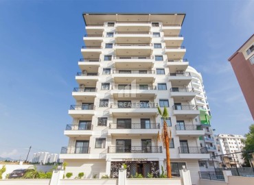 Стильные апартаменты 1+1 с дизайнерским интерьером, 55м², в комплексе премиум класса в Махмутларе, Алания ID-18835 фото-1