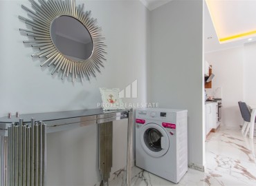 Стильные апартаменты 1+1 с дизайнерским интерьером, 55м², в комплексе премиум класса в Махмутларе, Алания ID-18835 фото-10