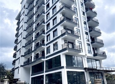 Элегантная двухкомнатная квартира, 55м², в новостройке с хорошей инфраструктурой в Махмутларе, Алания ID-18848 фото-1