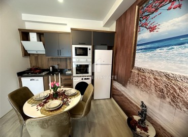 Элегантная двухкомнатная квартира, 55м², в новостройке с хорошей инфраструктурой в Махмутларе, Алания ID-18848 фото-10