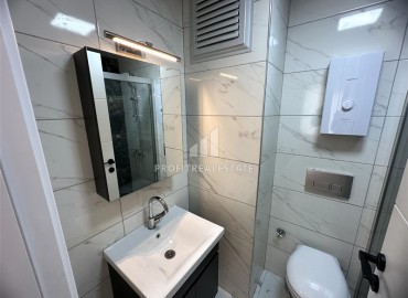 Элегантная двухкомнатная квартира, 55м², в новостройке с хорошей инфраструктурой в Махмутларе, Алания ID-18848 фото-11