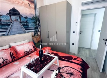 Элегантная двухкомнатная квартира, 55м², в новостройке с хорошей инфраструктурой в Махмутларе, Алания ID-18848 фото-13