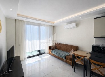 Меблированные апартаменты с одной спальней, 50м², в новостройке премиум класса в Авсалларе, Алания ID-18850 фото-2