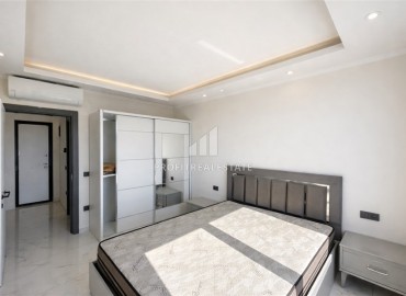 Меблированные апартаменты с одной спальней, 50м², в новостройке премиум класса в Авсалларе, Алания ID-18850 фото-4