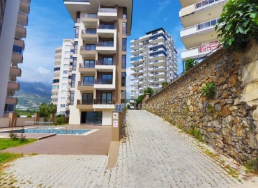 Двухкомнатные апартаменты, 55м². в современной резиденции с инфраструктурой, в районе Махмутлар, Алания ID-18854 фото-1