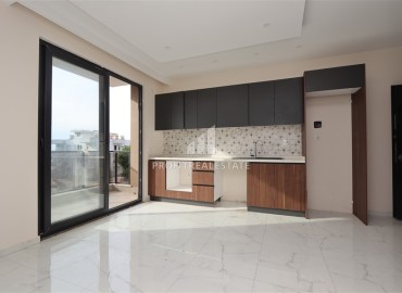 Двухкомнатные апартаменты, 55м². в современной резиденции с инфраструктурой, в районе Махмутлар, Алания ID-18854 фото-2