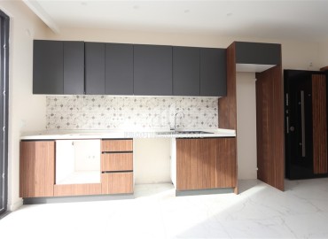 Двухкомнатные апартаменты, 55м². в современной резиденции с инфраструктурой, в районе Махмутлар, Алания ID-18854 фото-3